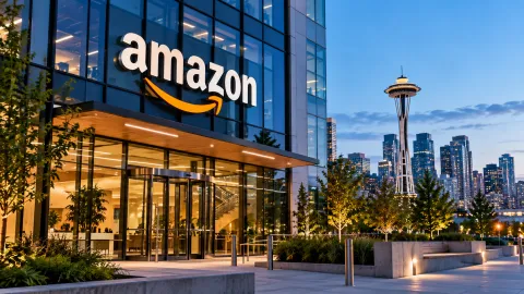 Amazon office building in Seattle with the Space Needle in the background, illustrating Amazon cuts 84 jobs across Washington state.