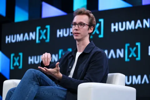 Legora co-founder speaking on stage at a technology conference, illustrating the Legora Series E funding round.