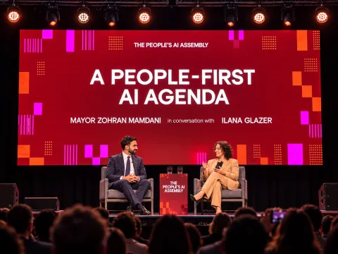 a people-first AI agenda at a conference, illustrating Mamdani AI regulation