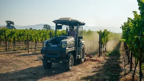 Monarch MK-V autonomous electric tractor operating in a vineyard, illustrating Monarch Tractor layoffs 2025 and the startup's restructuring.