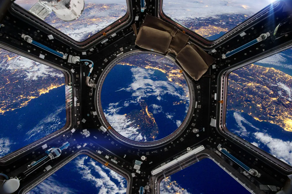Space situational awareness technology showing satellites orbiting Earth, orbital debris tracking, and AI-powered monitoring systems analyzing potential collision risks.