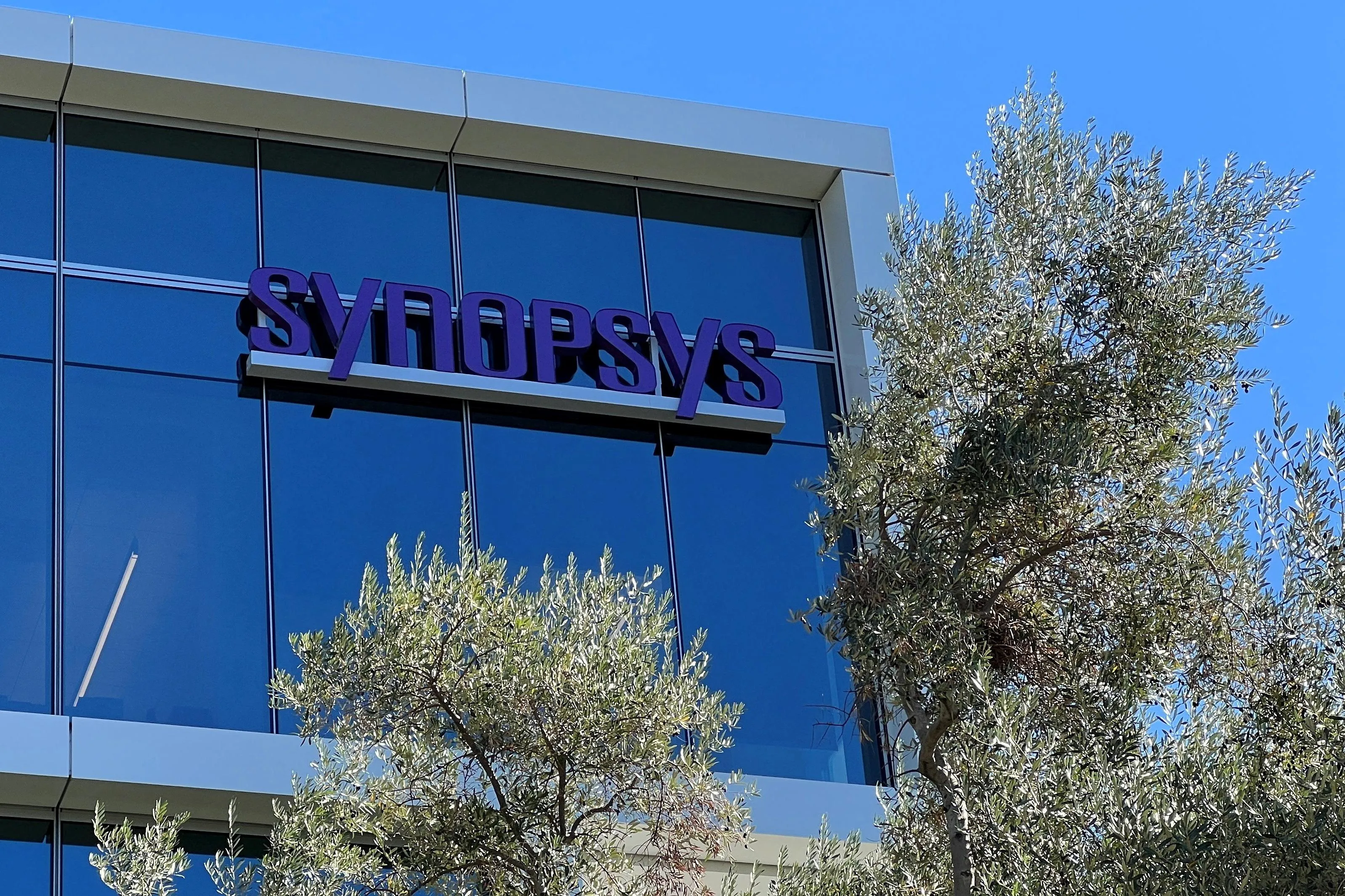 Synopsys corporate headquarters building displaying the company logo, illustrating Synopsys layoffs 2025 following the Ansys acquisition.