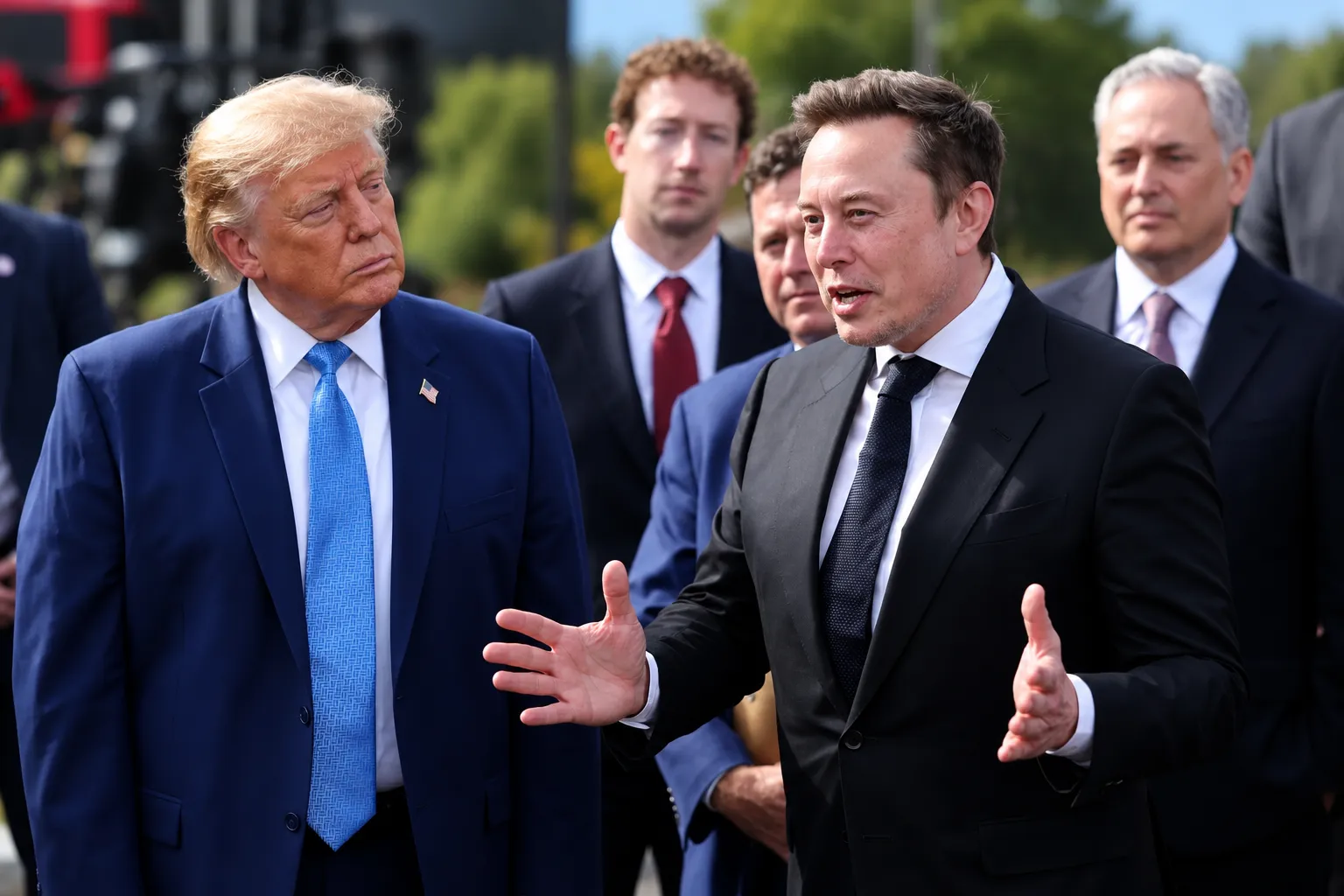 Alt text: Elon Musk and Donald Trump during a formal outdoor discussion.